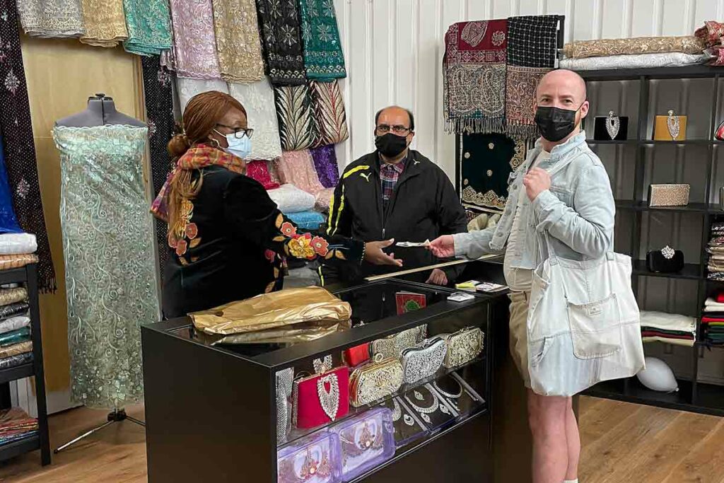 man buying cloth in shop